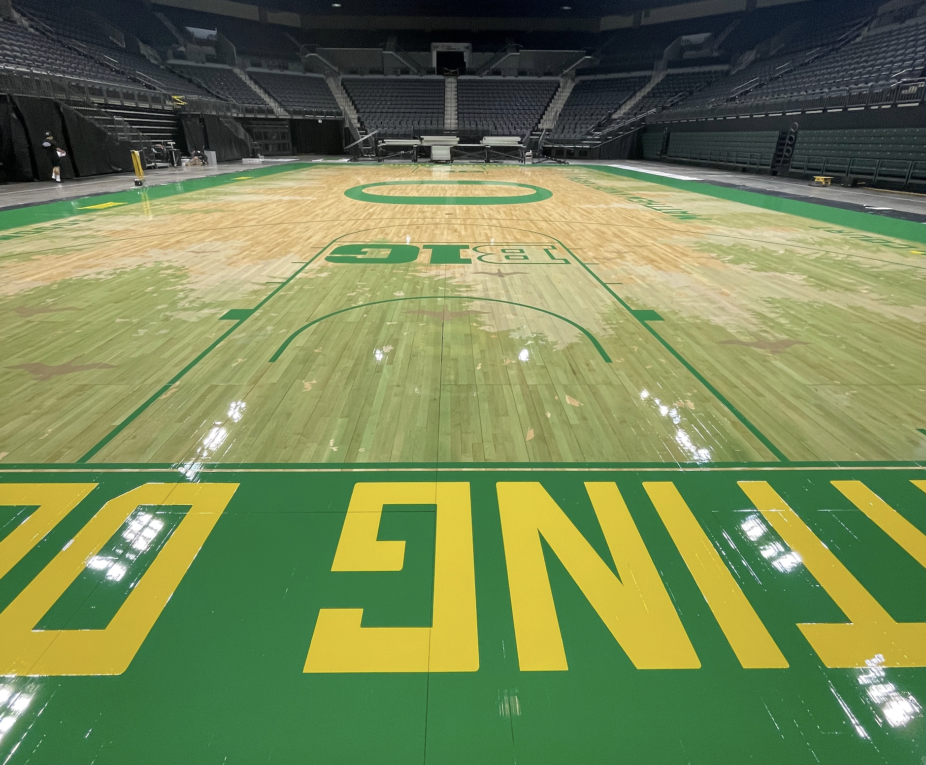 University of Oregon Ducks, Mathew Knight Arena, Eugene, Oregon - basketball gym floor sanding, painting, artwork , stencils, design, and finishing by COURTSPORTS.